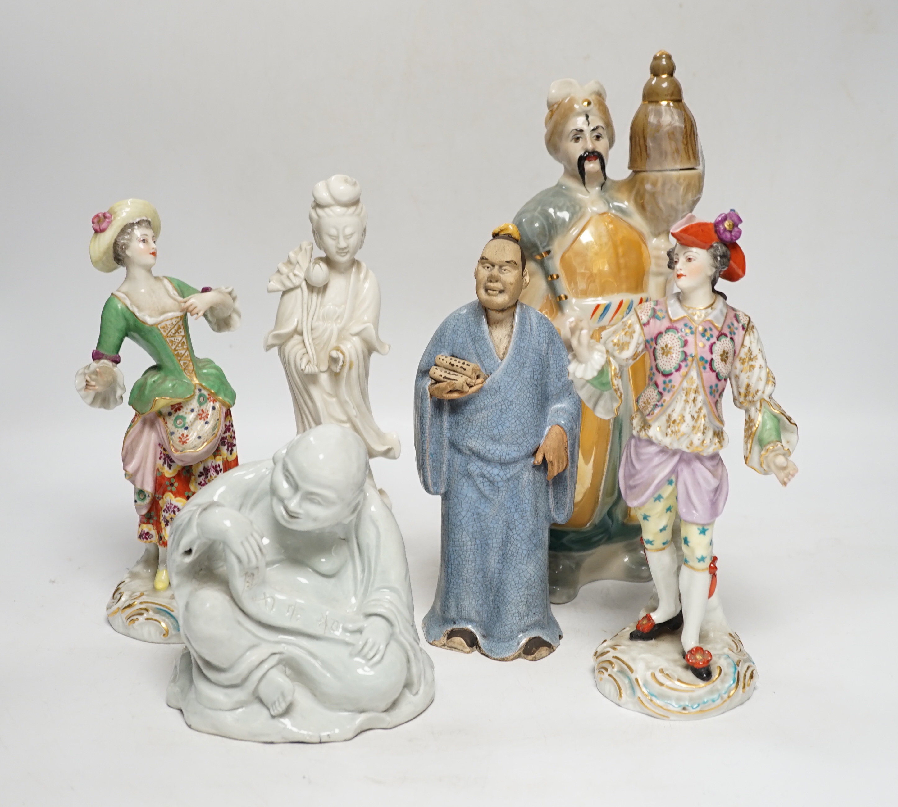 Eight porcelain figures including a pair of German style figures, a large Figo group, feeding a lamb, two Chinese figures, a bust of Beethoven, etc. largest 37cm